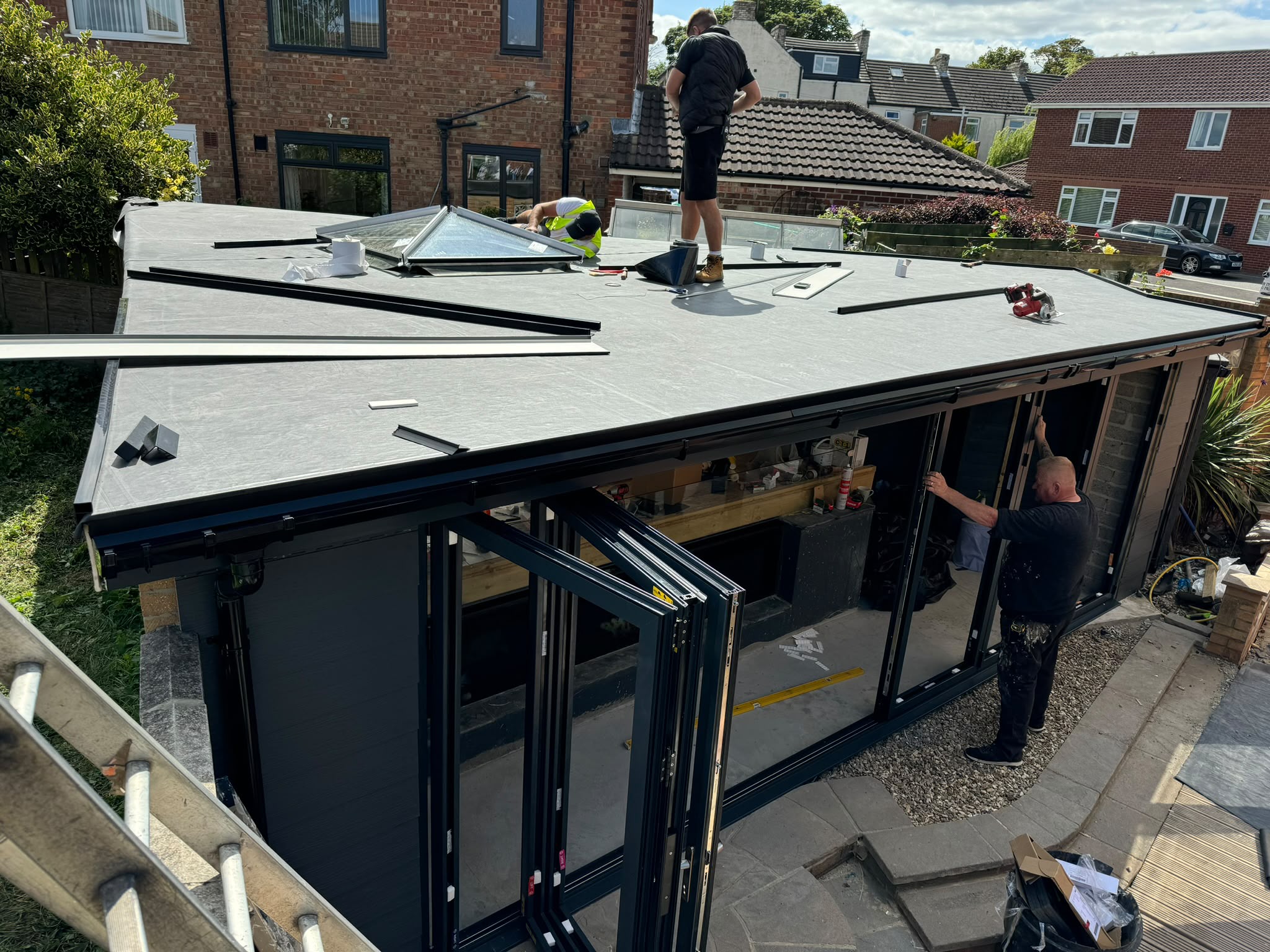 An EPDM rubber flat roof membrane installation