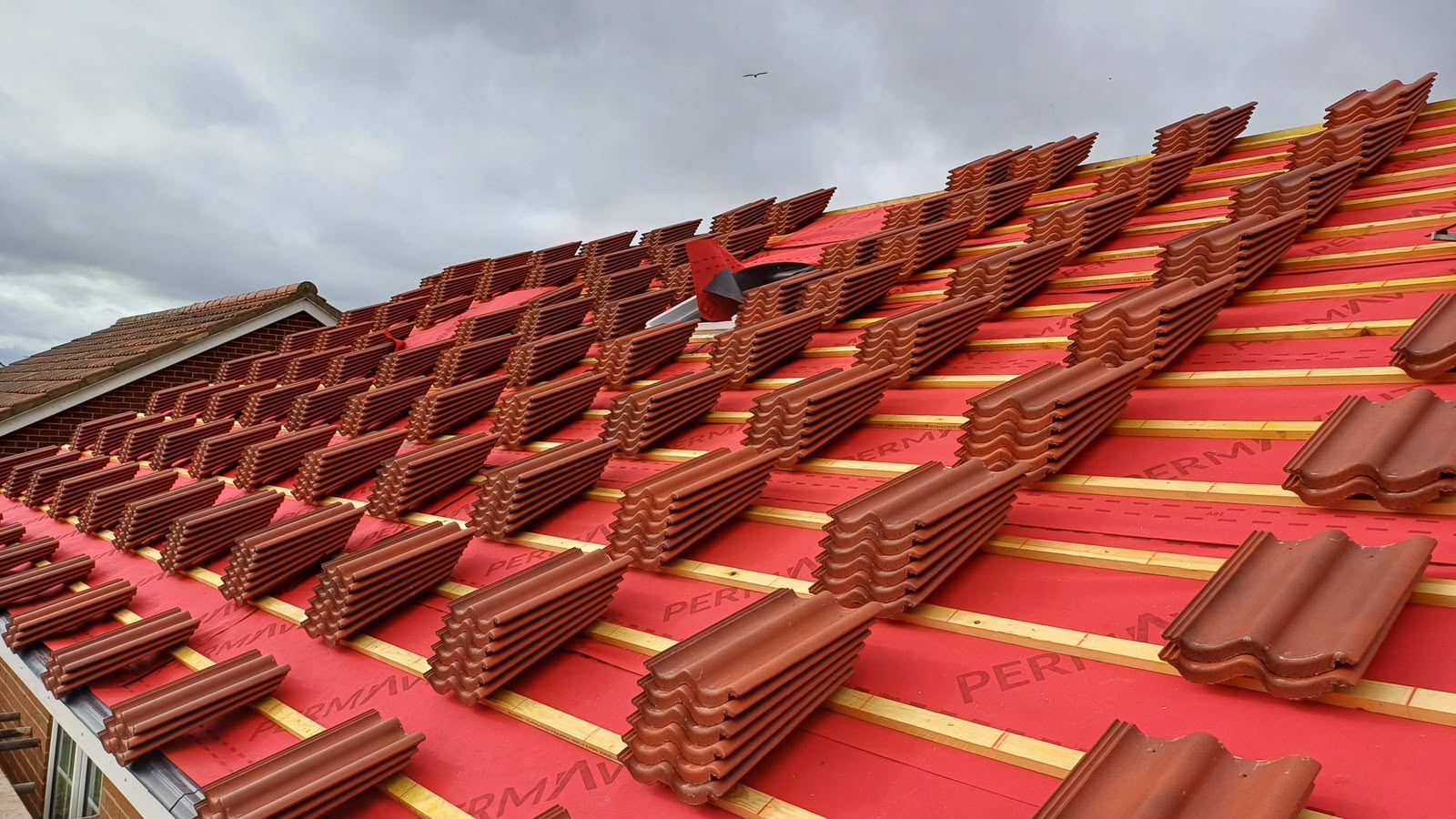 A pitched tiled roof maintained by Roofing North East